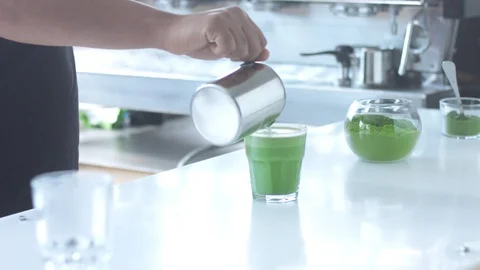 Matcha tea preparation in cafe by mixed race barman Stock Footage 87908755