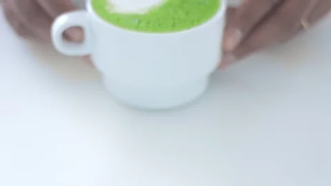 Matcha tea preparation in cafe by mixed race barman Video stock 87908846