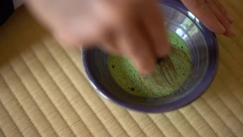 Matcha whisking with bamboo tool Stock Footage 131244809