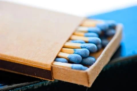 Matchbox with blue heads 写真素材