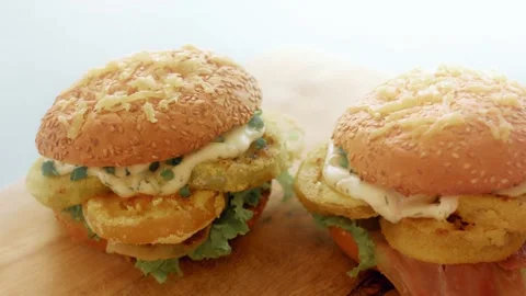 Matched pair of fish burgers displayed in even daylight, 4K Vídeo Stock 341119946