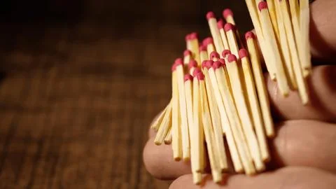 Matches are falling from your hands. Matches from the box on the arm. Close-up Stock Photos