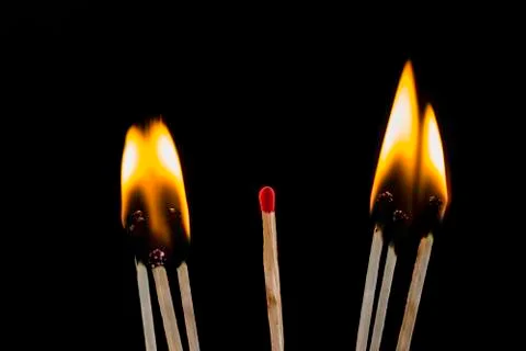 Matches with black background. Stock Photos