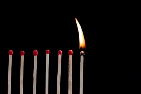 Matches with black background. Stock Photos