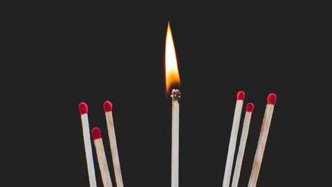 Matches with black background. Stock Photos