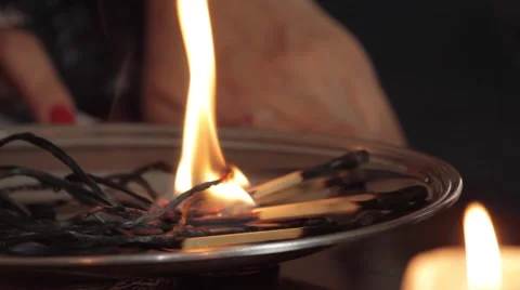 Matches burning on a plate. Stock Footage 62427624