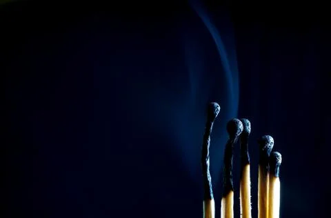 Matches on a dark background Foto stock
