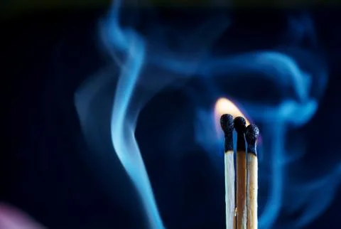 Matches on a dark background Stock Photos