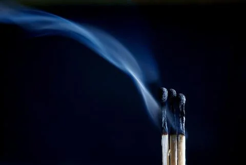 Matches on a dark background Stock Photos