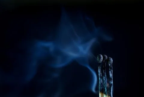 Matches on a dark background Stock Photos