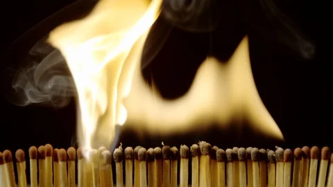 Matches igniting from one to another, Ultra Slow Motion Stock Footage 86576063