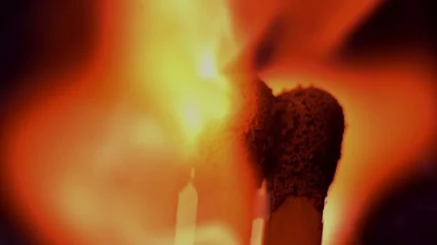 Matches inginiting burning extreme macro close up background. A beautiful flame Video stock 74976463