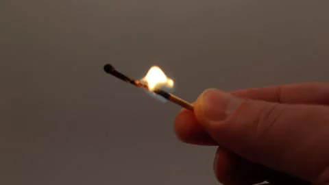 Matches light a burning fire. Halloween holiday decor. Stock Footage 319789699