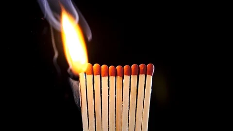 Matches light up one by another in series Stock Footage 94988828