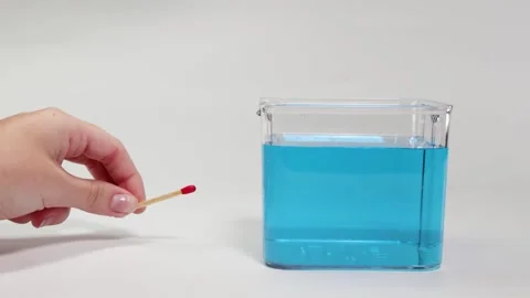 Matchstick Floating and Sinking in Blue Liquid Video stock 308431688