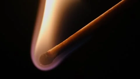 Matchstick Ignites on a black background, slow motion. Stock Footage 325910645
