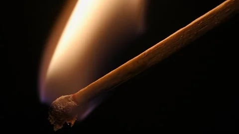 Matchstick Ignites on a black background, slow motion. Stock Footage 325910648
