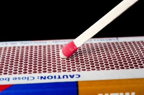Matchstick on striking surface Stock Photos