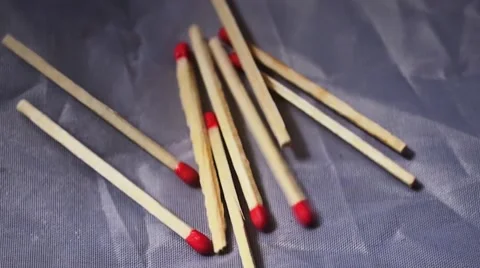 Matchsticks jumping around on white material, macro overhead shot 動画素材 46023598