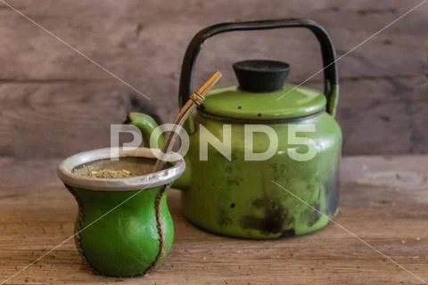 Mate and kettle, traditional Argentine yerba mate infusion, on rustic ...