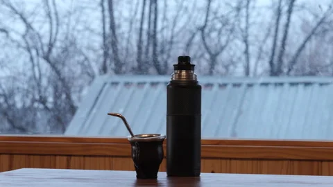 Mate Drink and Thermos by Window Snowy Winter Minimal Cozy Scene Stock Footage 334555479