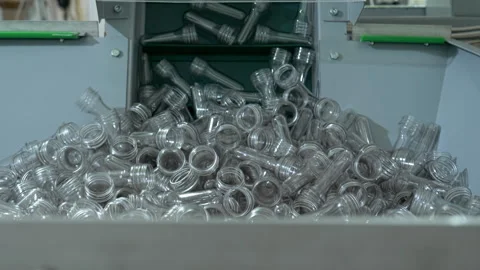 Material for bottle blowing process. Industrial line at modern drink factory Stock Footage 133226819