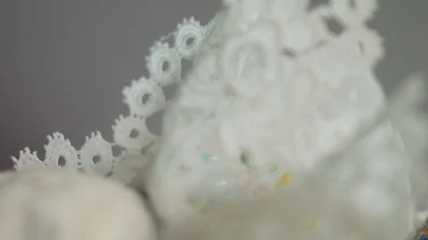 Material with doily pattern and pearls and embroidery used for creating a Stock Footage 119215149