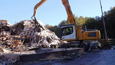 Material handler picking up waste for pallet recycling to produce biomass Stock Footage 313917916