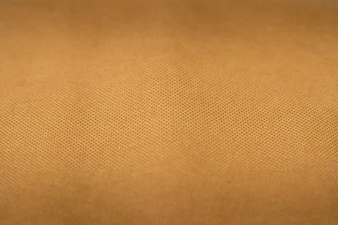 Material of light brown polyamide tissue bag, close up. Stock Photos