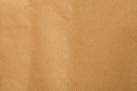 Material of light brown polyamide tissue bag texture, close up. Stock Photos