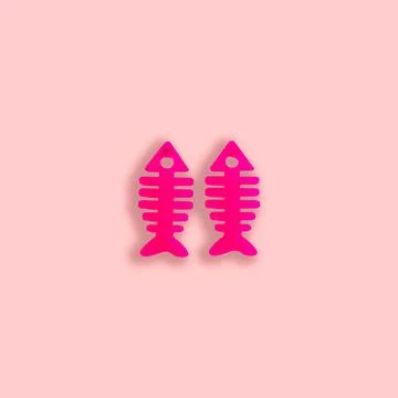 Material methacrylate with a fish shape design on a pastel color background. Stock Photos