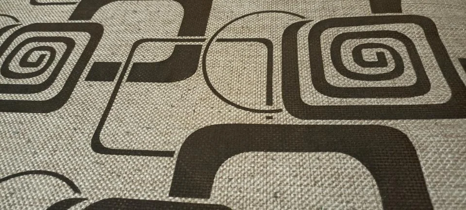 Material with a pattern of squares and spirals Stock Photos