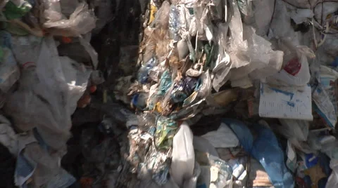 Material Recovery Facility. Plastic waste ready for reprocessing - zoom out. Stock Footage 61526570