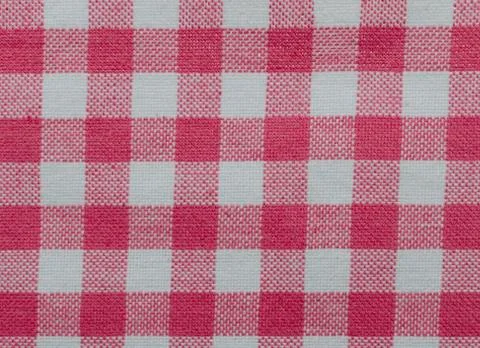 Material for a tea towel or table cloth with a checkered red and white Stock Photos
