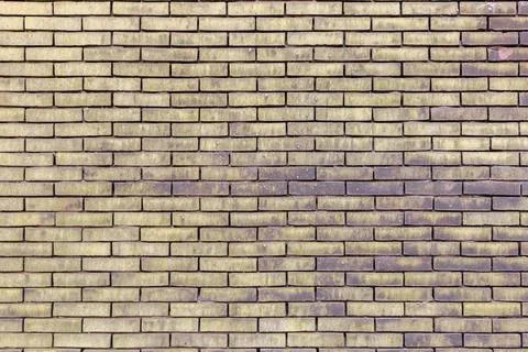 Material texture of beige yellow brick wall Stock Photos