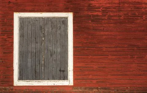 Material texture of boarded windows with weathered wood boards with peeling r Stock Photos