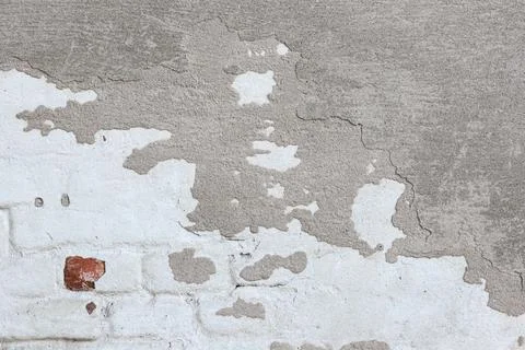 Material texture of damaged and cracked plaster wall, surface background. Stock Photos