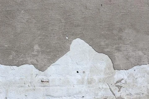 Material texture of damaged and cracked plaster wall, surface background. Stock Photos