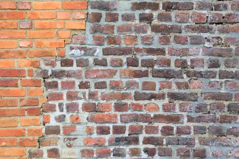 Material texture of damaged red brick wall Stock Photos