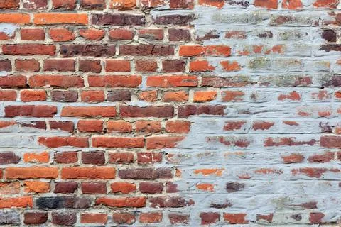 Material texture of damaged red brick wall Stock Photos