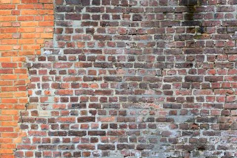 Material texture of damaged red brick wall Stock Photos