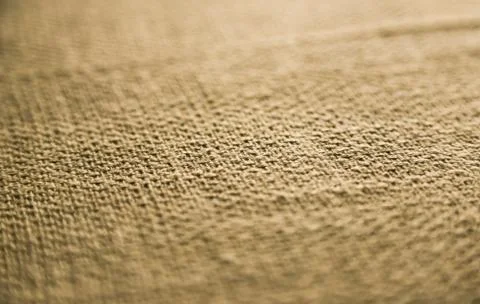 Material texture, with depth of field - Beige colour with light vignette. Stock Photos