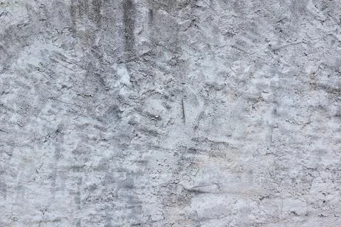 Material texture of dirty and irregular plaster on wall surface Stock Photos