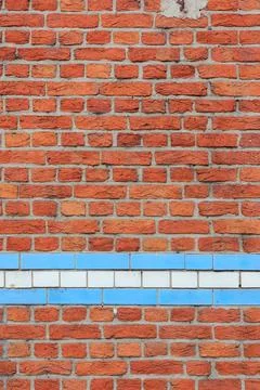Material texture of red brick wall with blue and white lines Stock Photos