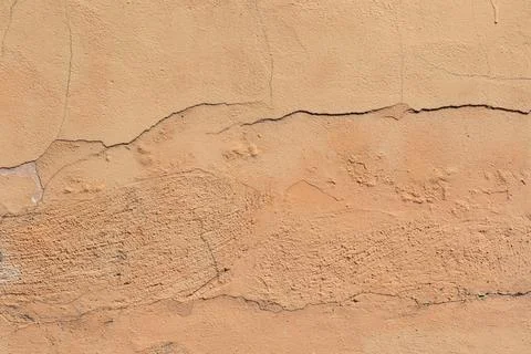 Material texture of terracotta painted plastered wall with imperfections and  Stock Photos