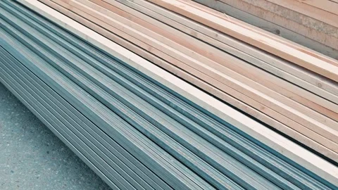 Materials are arranged in a neat order, displaying wooden beams and metal strips Stock Footage 339095918