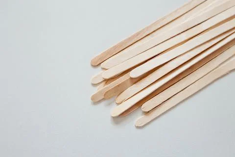 Materials for depilation of eyebrows and delicate areas. Wooden sticks lie 写真素材