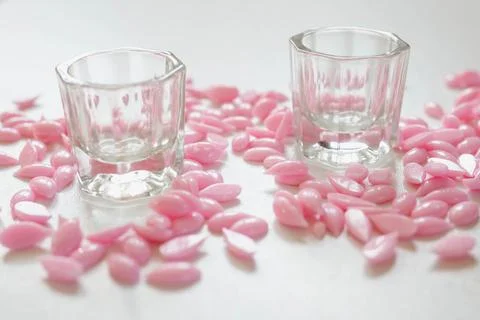 Materials for depilation of eyebrows and delicate areas. Pink wax granules, w Stock Photos
