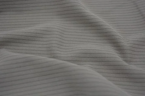 Materials, light green, brown thin fabric with texture and small lines. Stock Photos