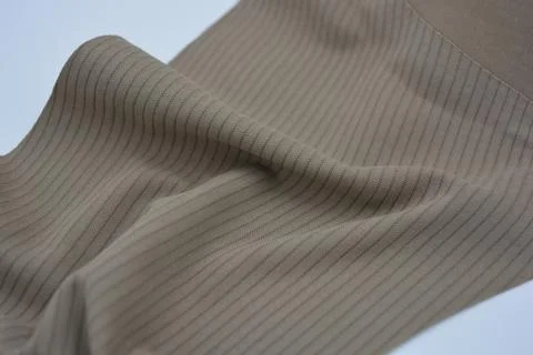 Materials, light green, brown thin fabric with texture and small lines. Stock Photos